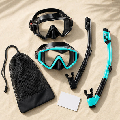 Complete snorkel kit flat lay with masks, dry-top snorkels, mesh carry bag, and travel accessories