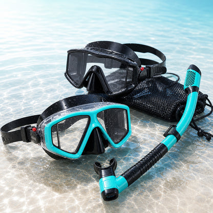 Black and aqua panoramic snorkel sets with mesh bag on clear water background